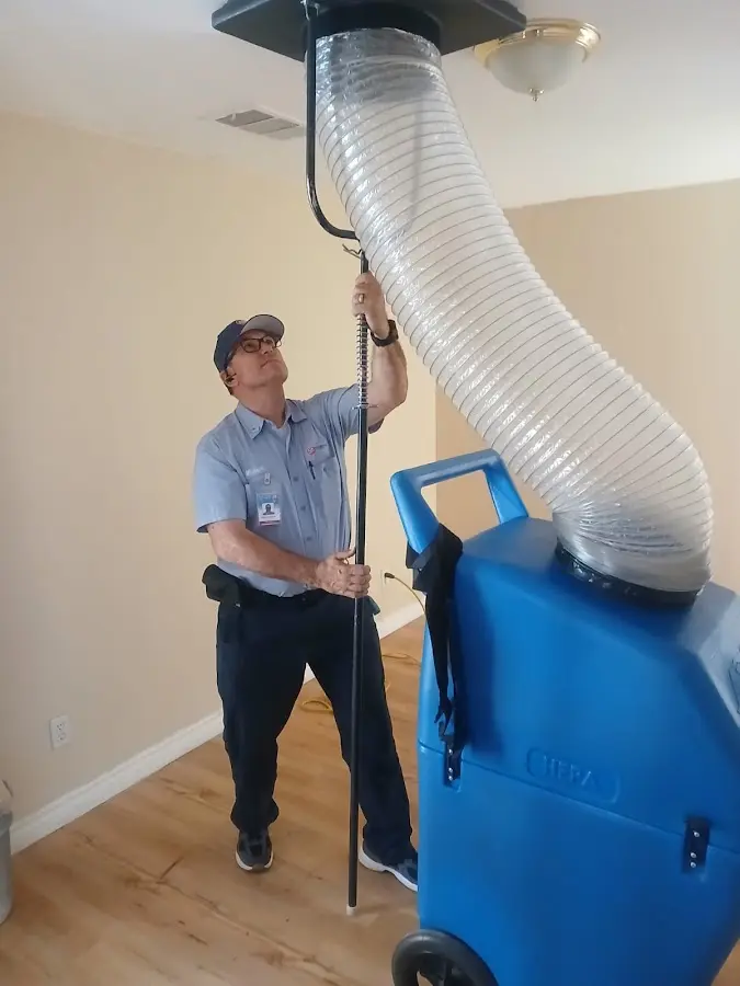 Furnace Tune-Up technician using HEPA equipment in Solana Beach